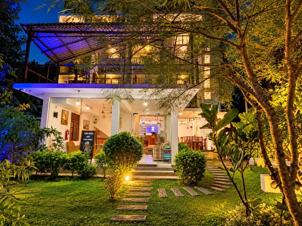 Warmly Lit Garden Guesthouse at Dusk