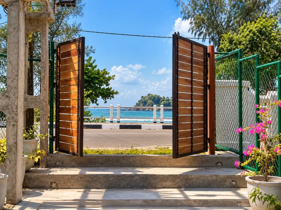 Garden gate opening onto the sea at Weligama