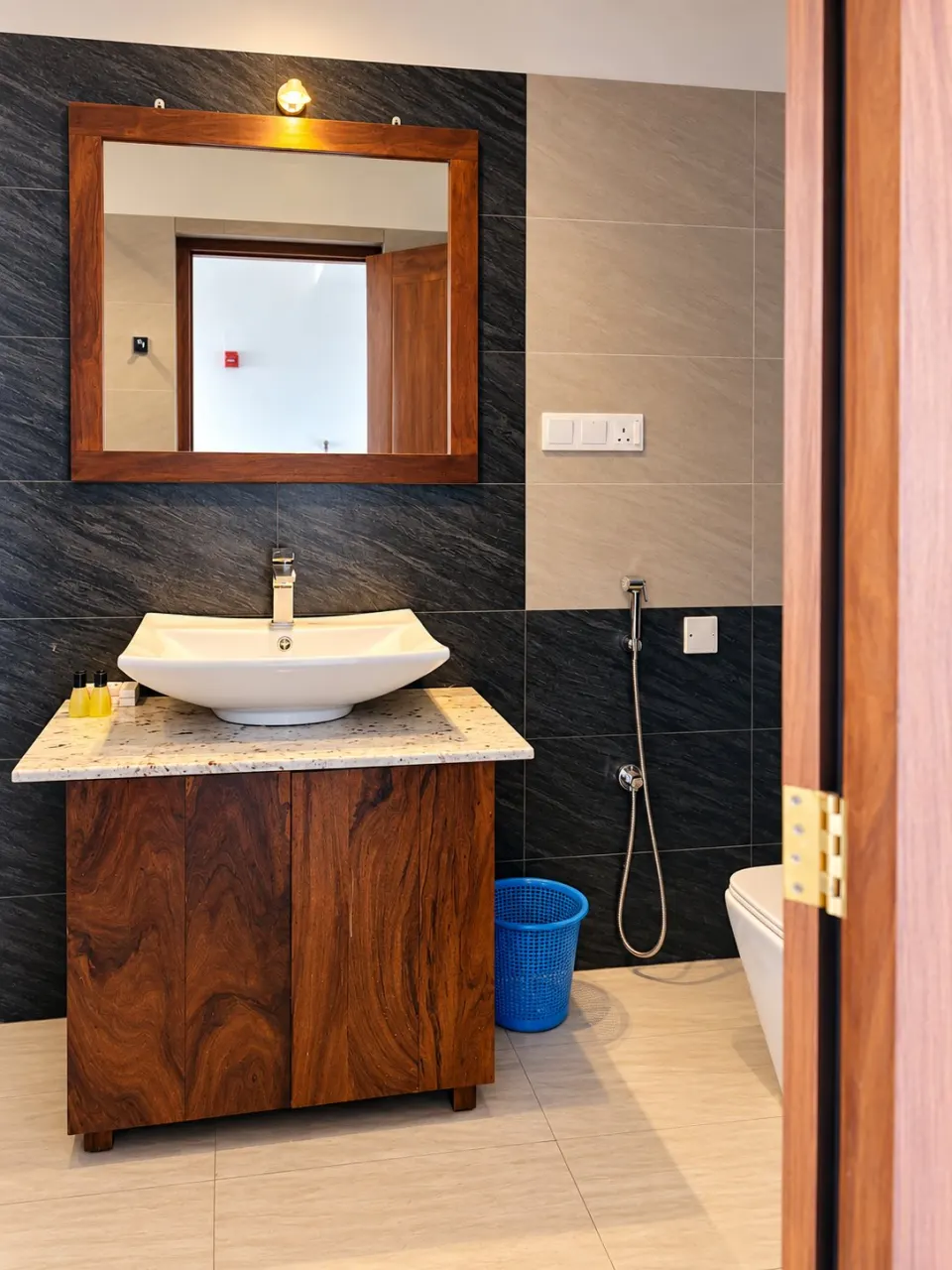 Luxury Sea Front with Private Balcony: modern bathroom through wooden door