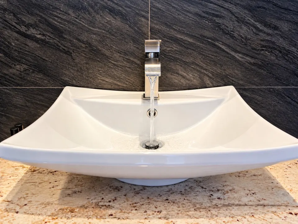 Sea View Deluxe Suite: modern vessel sink with running water