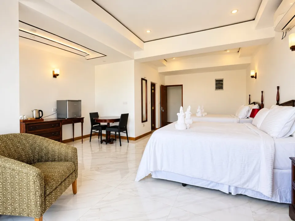 Sea View Deluxe Suite: spacious luxury hotel bedroom interior
